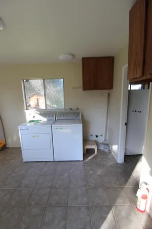 a spacious bathroom with a sink and a mirror