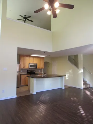 a kitchen with a stove and a kitchen view