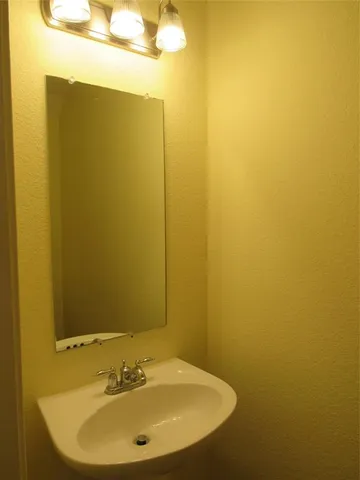 a view of a room with a ceiling fan