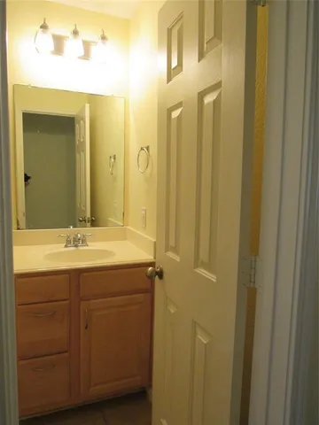 a white toilet sitting next to a bath tub