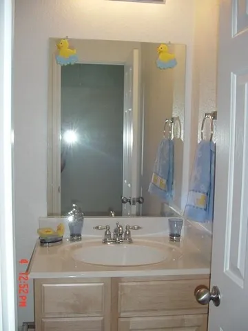 a white toilet sitting next to a bath tub