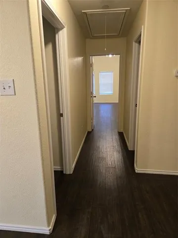 an empty room with wooden floor