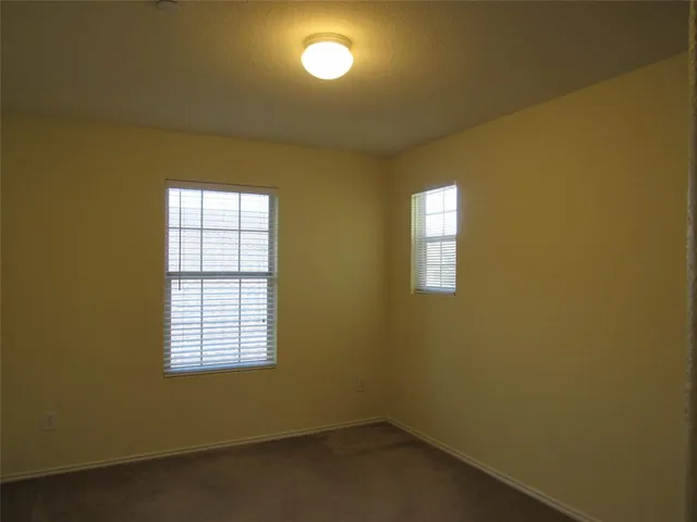 an empty room with a empty space and a window