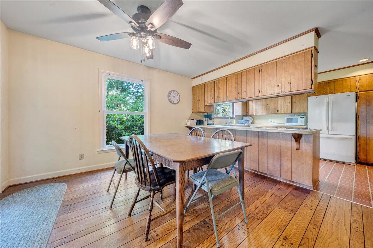 404 Robin Ridge Road Rocky Mount, VA 24151 - Photo 17 of 56 a view of a dining room with furniture window and wooden floor