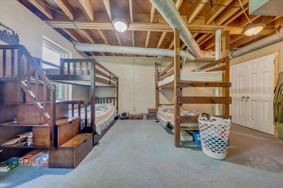 404 Robin Ridge Road Rocky Mount, VA 24151 - Photo 42 of 56 a view of an empty room with racks on the wall