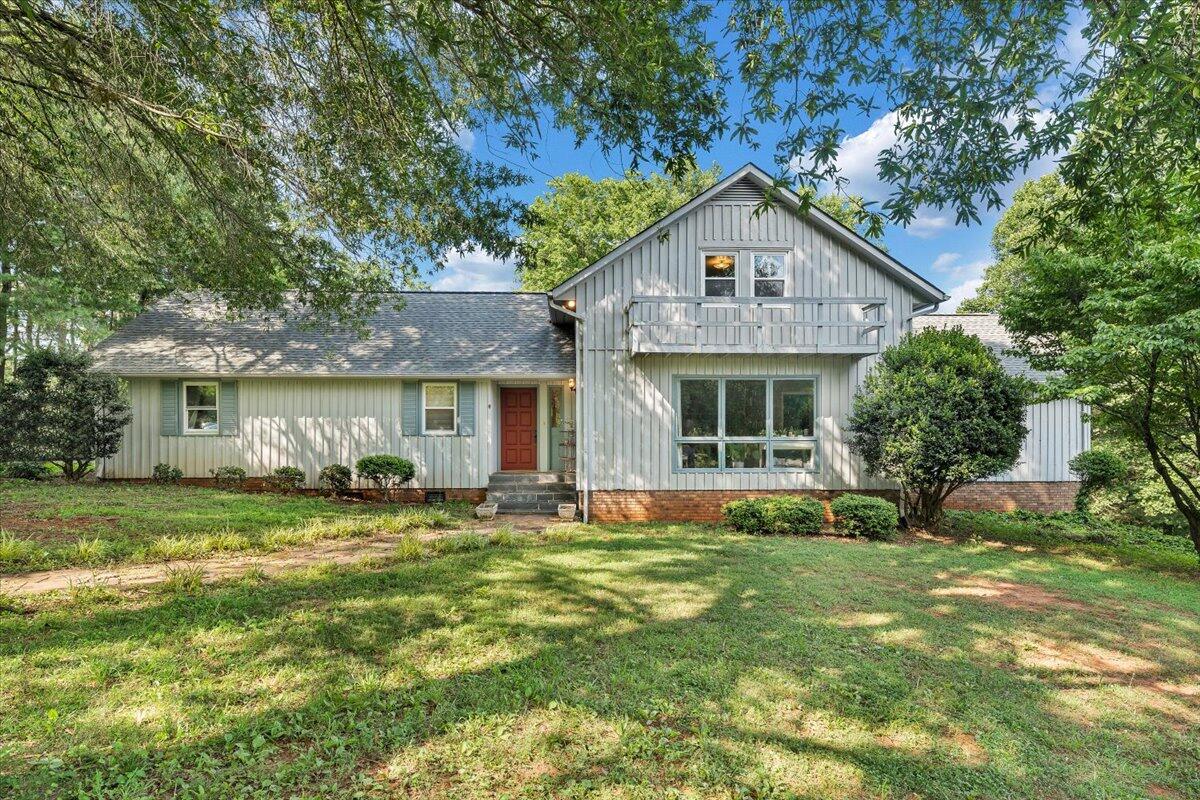 404 Robin Ridge Road Rocky Mount, VA 24151 - Photo 5 of 56 a front view of a house with a yard