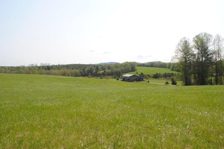 404 Robin Ridge Road Rocky Mount, VA 24151 - Photo 6 of 56 a view of a field with an trees
