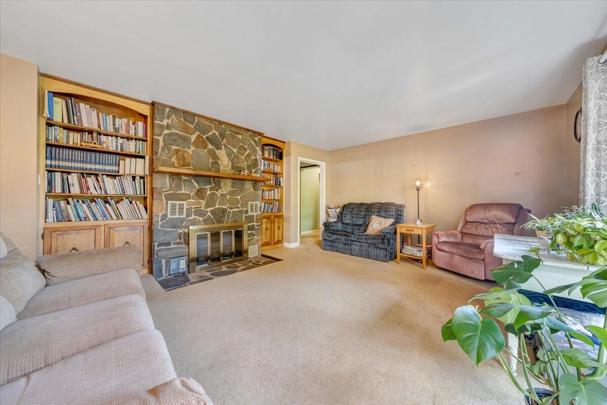 404 Robin Ridge Road Rocky Mount, VA 24151 - Photo 8 of 56 a living room with furniture and a fireplace