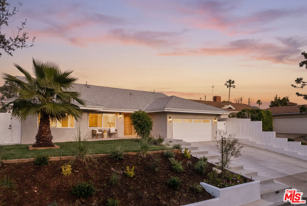 880 Teakwood Road Los Angeles, CA 90049 - Photo 2 of 38 a view of house with outdoor space and street