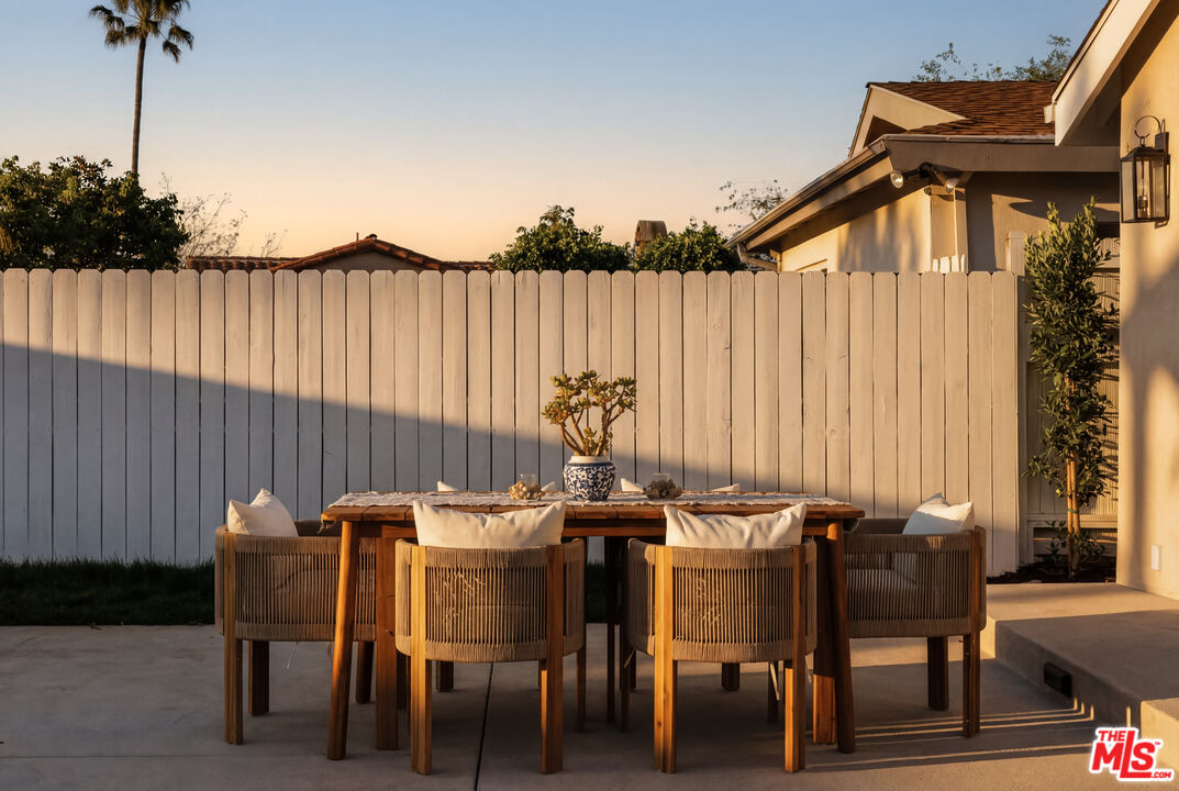 880 Teakwood Road Los Angeles, CA 90049 - Photo 31 of 38 a dining room with furniture and wooden floor