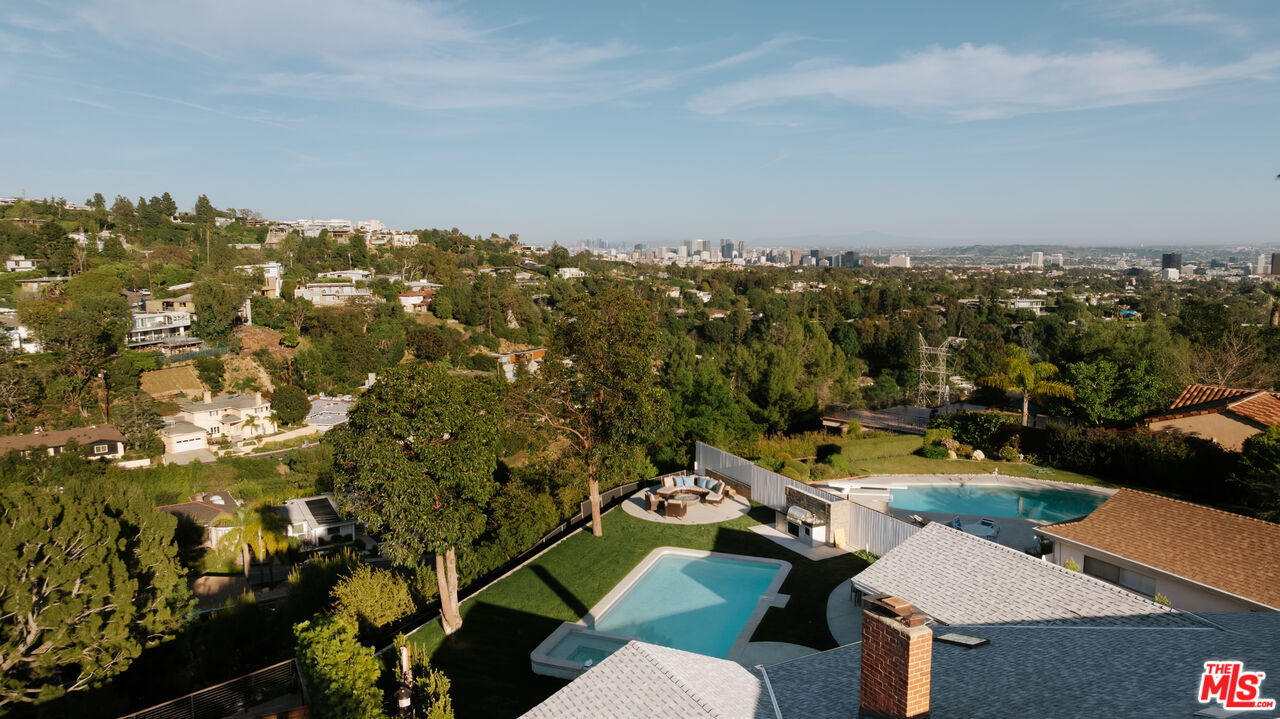 880 Teakwood Road Los Angeles, CA 90049 - Photo 37 of 38 an aerial view of a houses with a swimming pool