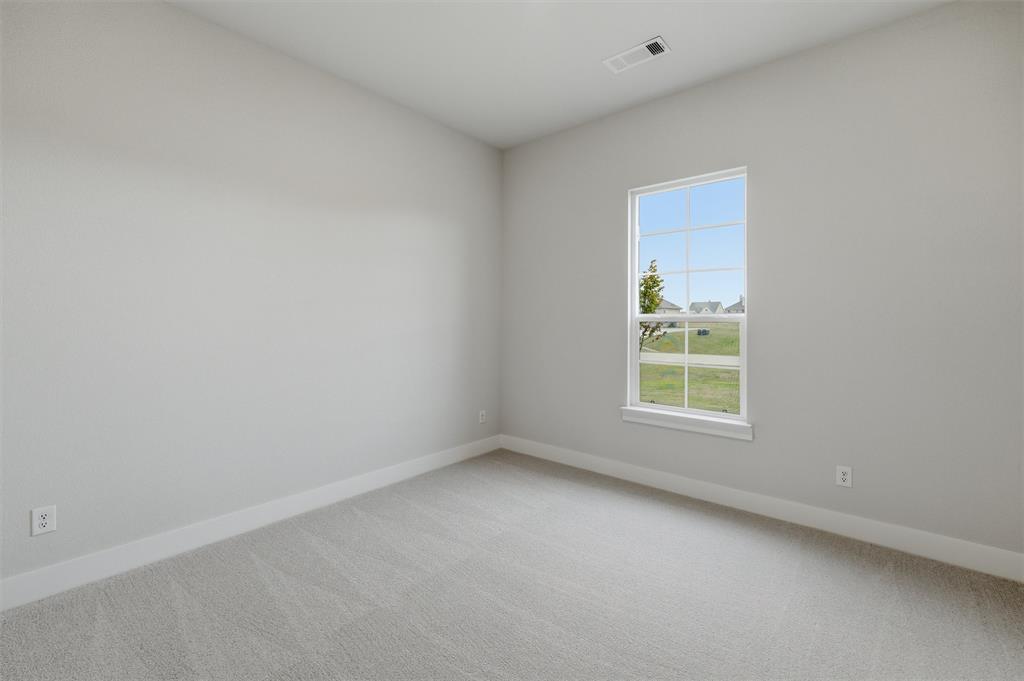 809 Vly Rdg Road Van Alstyne, TX 75495 - Photo 14 of 30 an empty room with a window