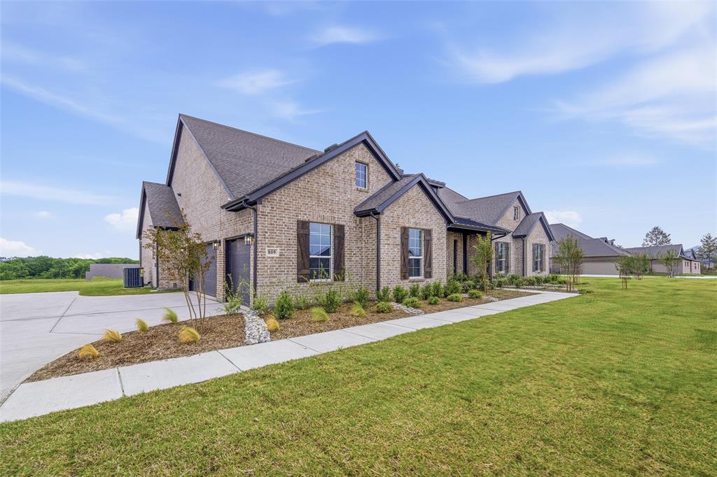 809 Vly Rdg Road Van Alstyne, TX 75495 - Photo 2 of 30 a front view of a house with a yard and garage