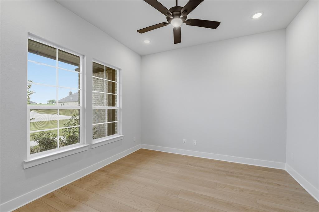 809 Vly Rdg Road Van Alstyne, TX 75495 - Photo 23 of 30 an empty room with a window and a ceiling fan