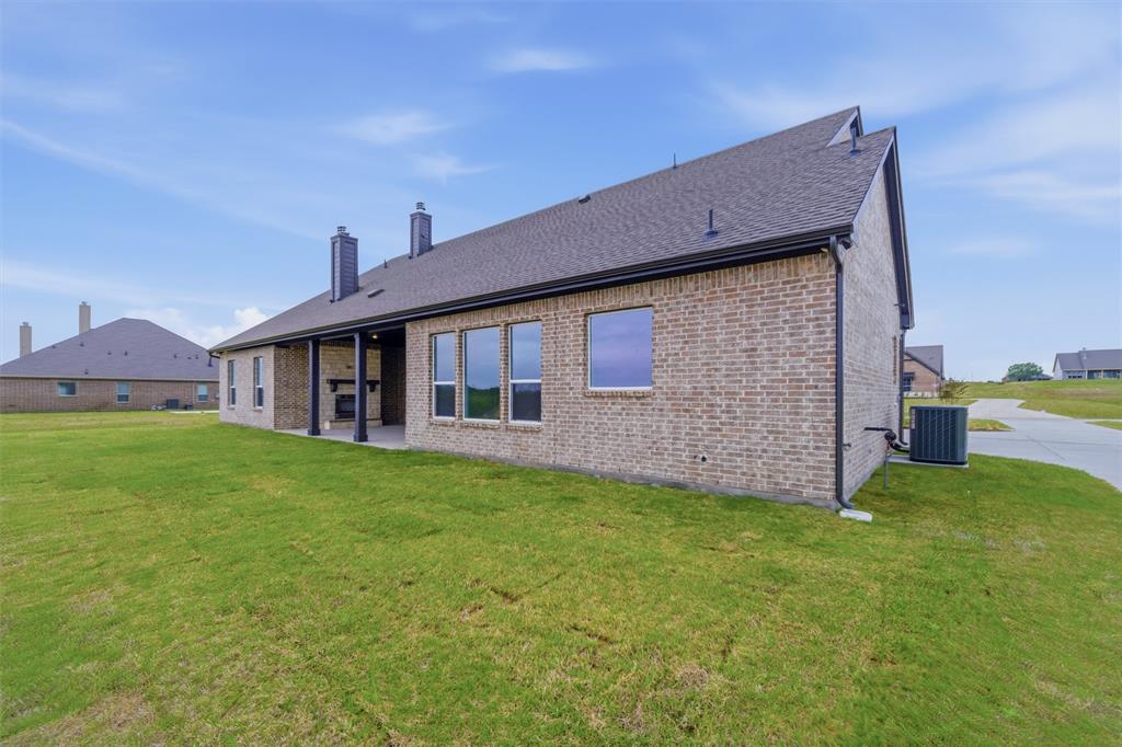 809 Vly Rdg Road Van Alstyne, TX 75495 - Photo 27 of 30 a house view with a garden space