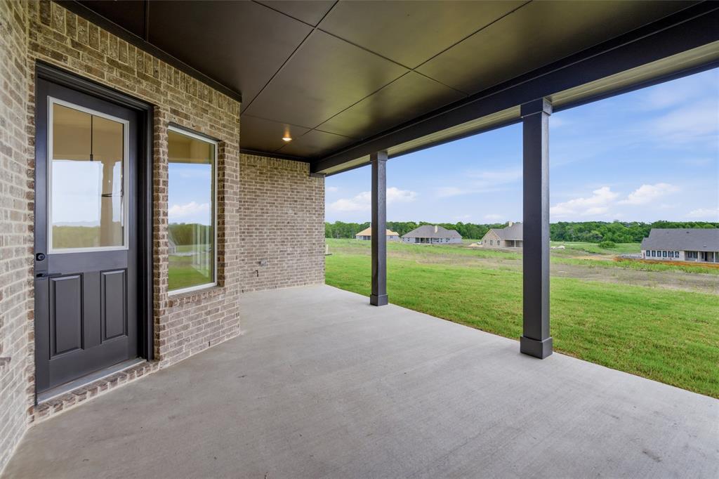 809 Vly Rdg Road Van Alstyne, TX 75495 - Photo 29 of 30 a view of a porch with a big yard