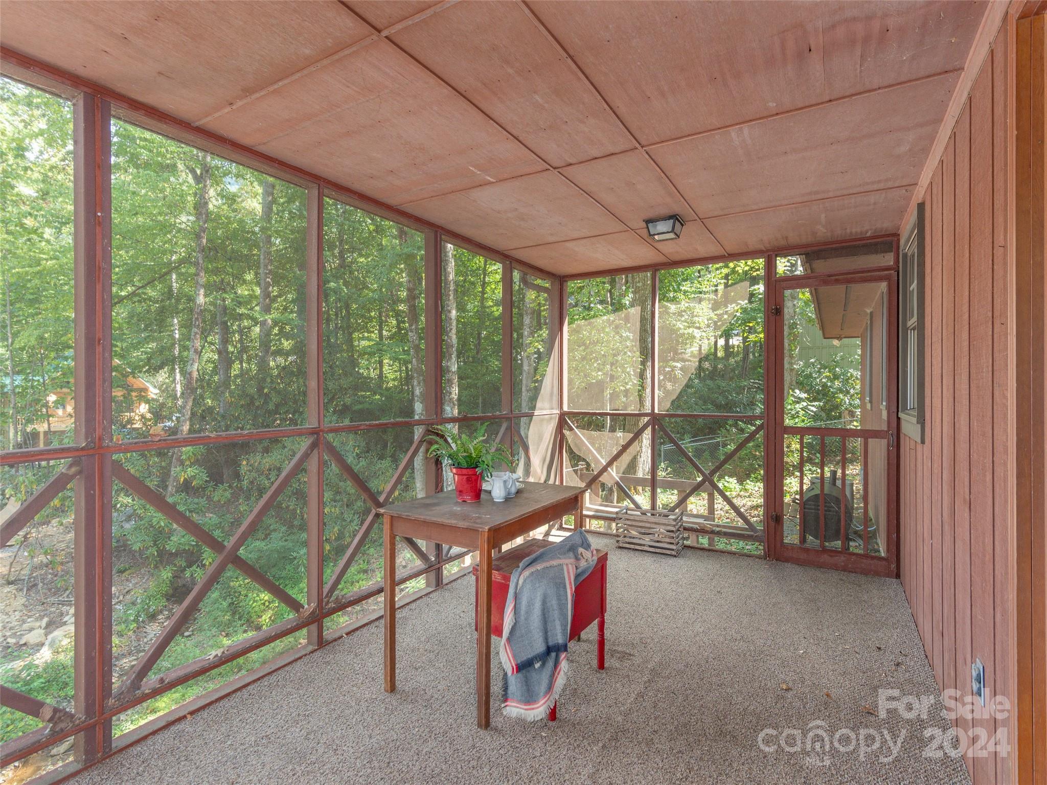 183 Reuben Branch Road Maggie Valley, NC 28751 - Photo 12 of 29 a view of a room with wooden floor and windows