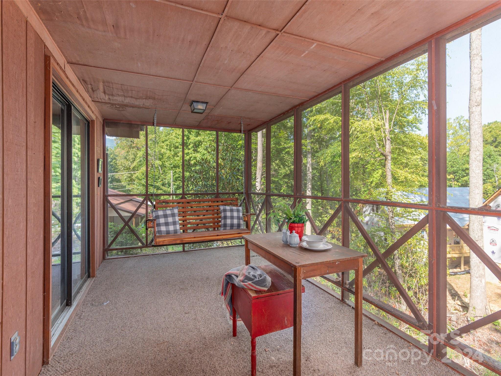 183 Reuben Branch Road Maggie Valley, NC 28751 - Photo 19 of 29 a room with furniture and large windows