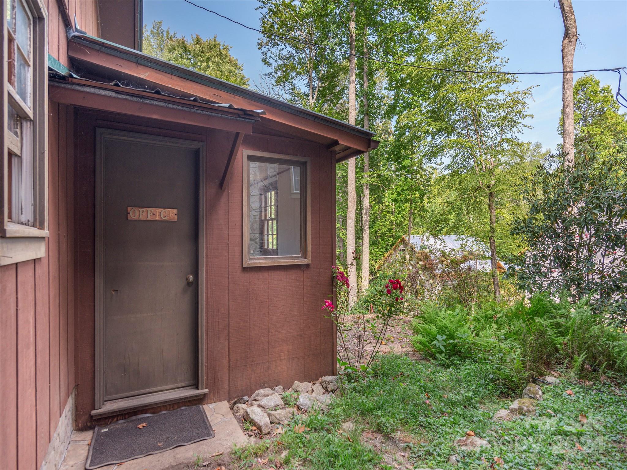 183 Reuben Branch Road Maggie Valley, NC 28751 - Photo 27 of 29 a view of a house with a small garden