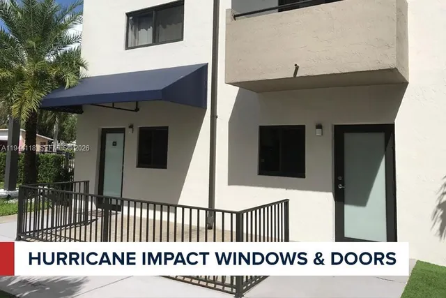 a view of a house with a small yard