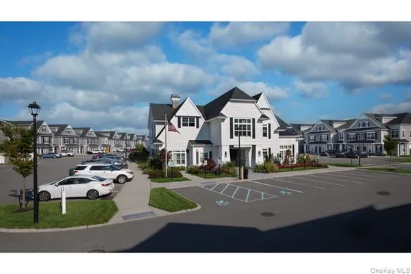 a view of multiple houses with a street