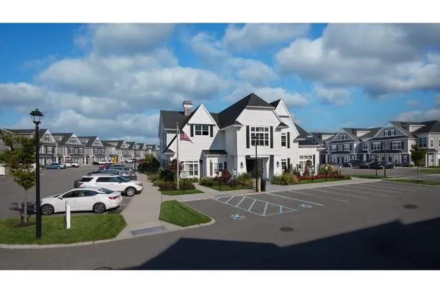 a view of multiple houses with a street
