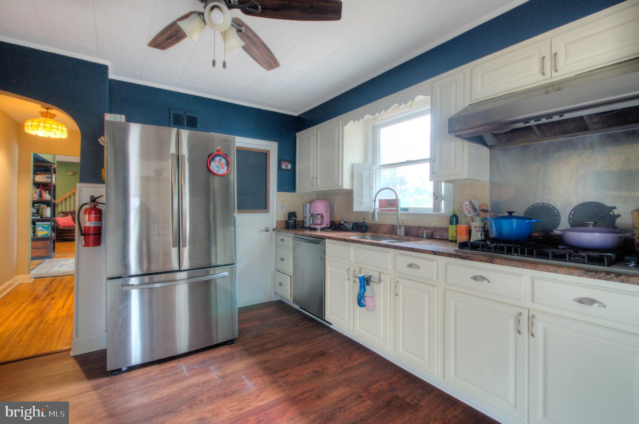 10 Linden Road Bordentown, NJ 08505 - Photo 39 of 70 a kitchen with granite countertop stainless steel appliances a sink and a refrigerator