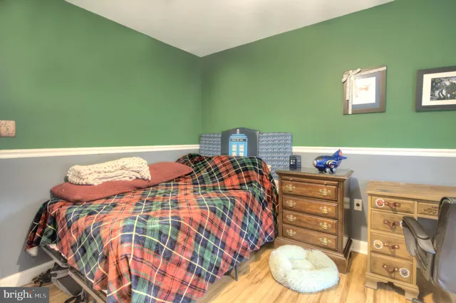 a bed room with a bed and a large mirror