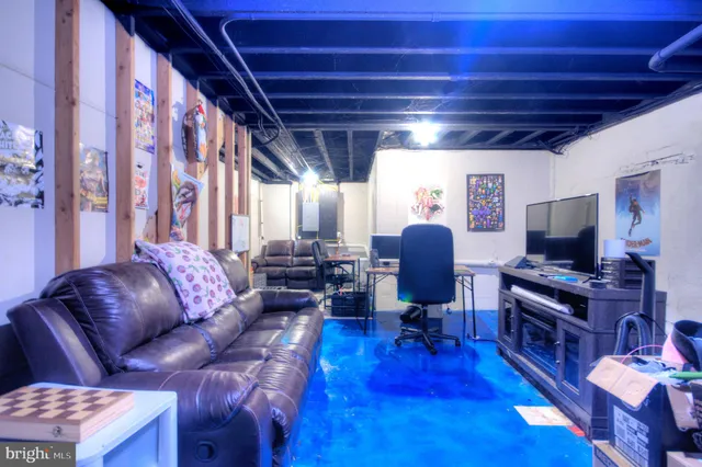 a bedroom with a bed and a large mirror