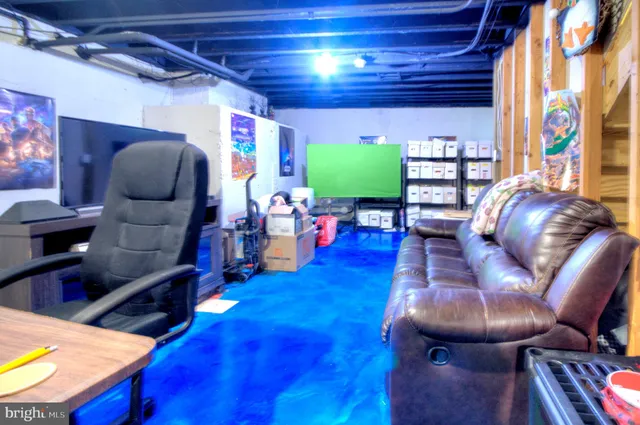 a bathroom with a granite countertop toilet sink and mirror