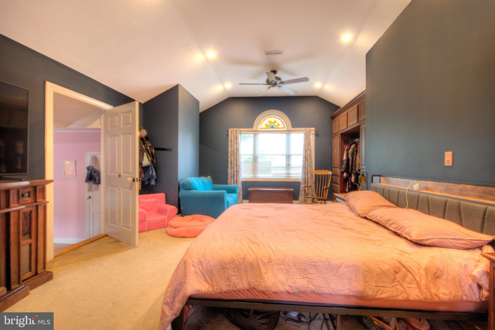 10 Linden Road Bordentown, NJ 08505 - Photo 49 of 70 a bedroom with a bed and a chandelier