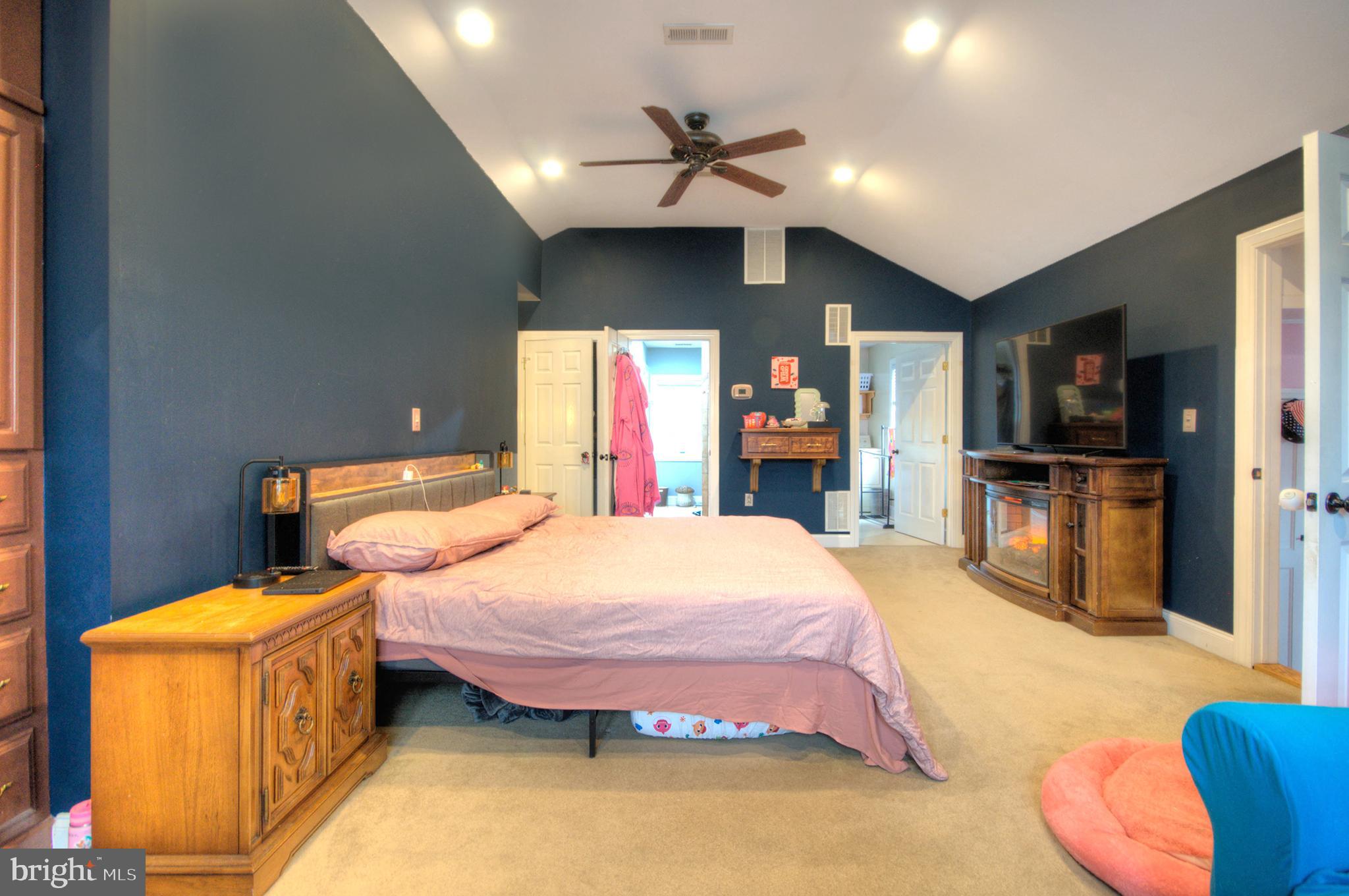 10 Linden Road Bordentown, NJ 08505 - Photo 51 of 70 a spacious bedroom with a bed and a flat screen tv