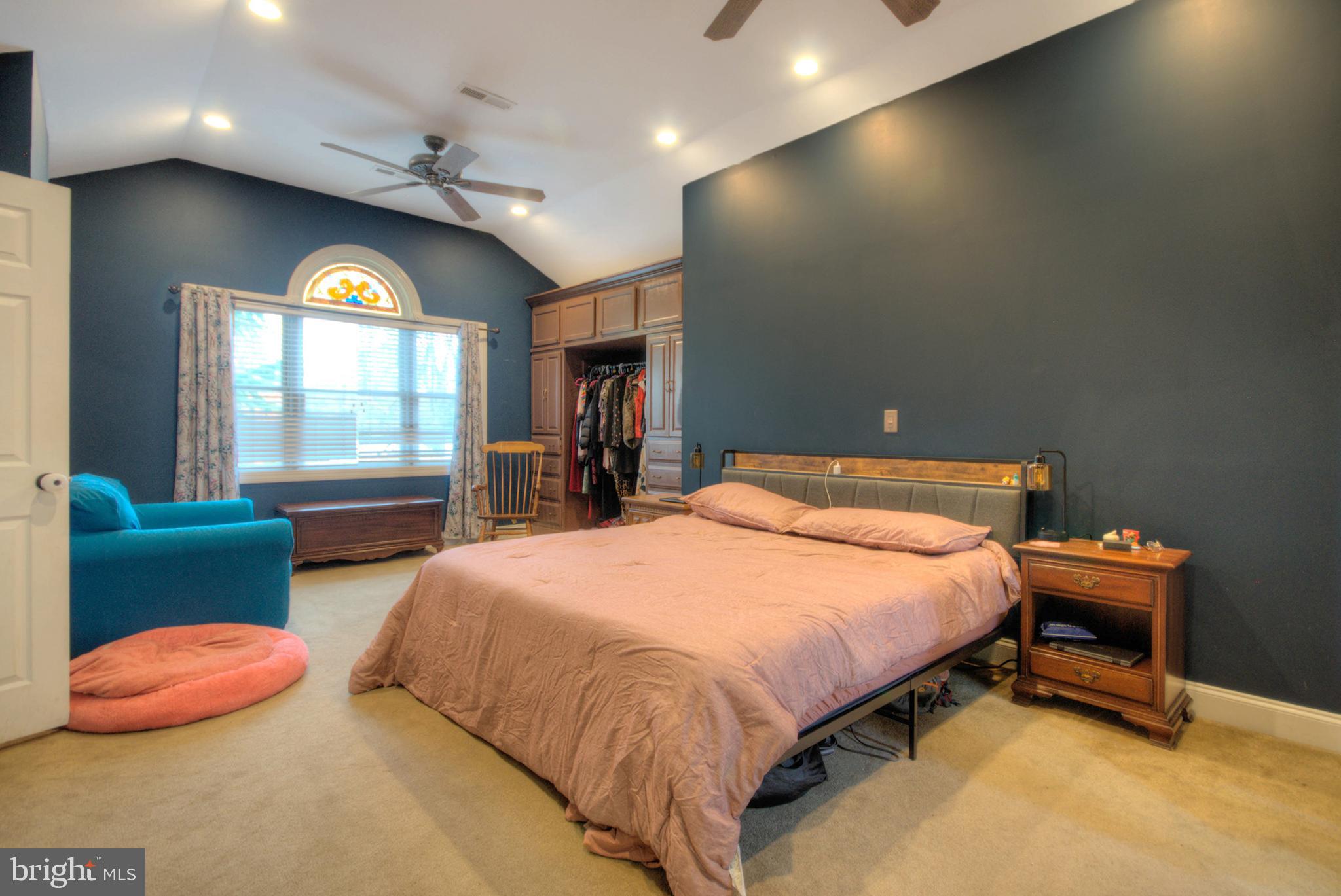 10 Linden Road Bordentown, NJ 08505 - Photo 59 of 70 a spacious bedroom with a bed and a couch