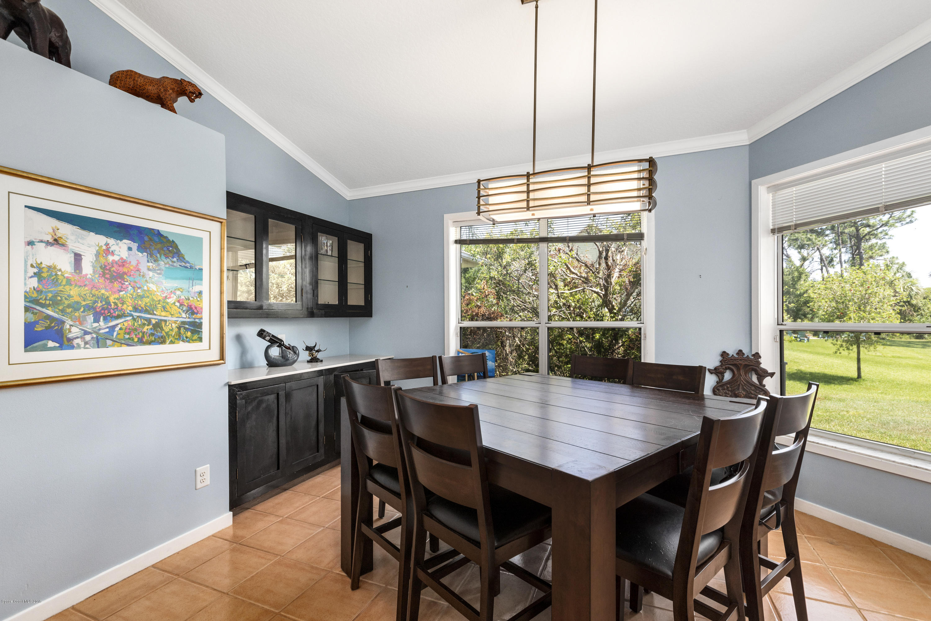 4231 Turtle Mound Road Melbourne, FL 32934 - Photo 12 of 39 a view of a dining room with furniture window and outside view