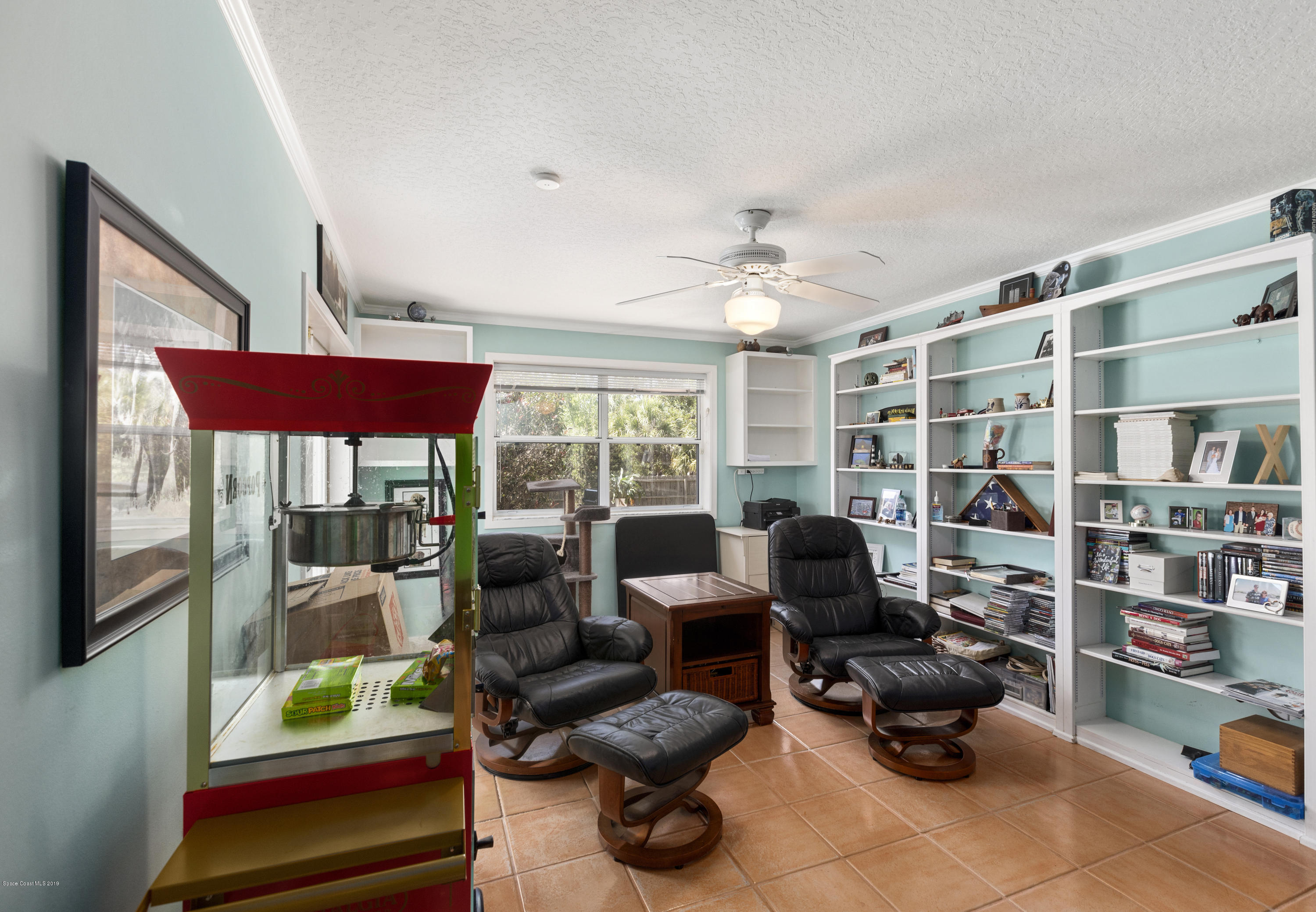 4231 Turtle Mound Road Melbourne, FL 32934 - Photo 13 of 39 a living room with furniture and a large window