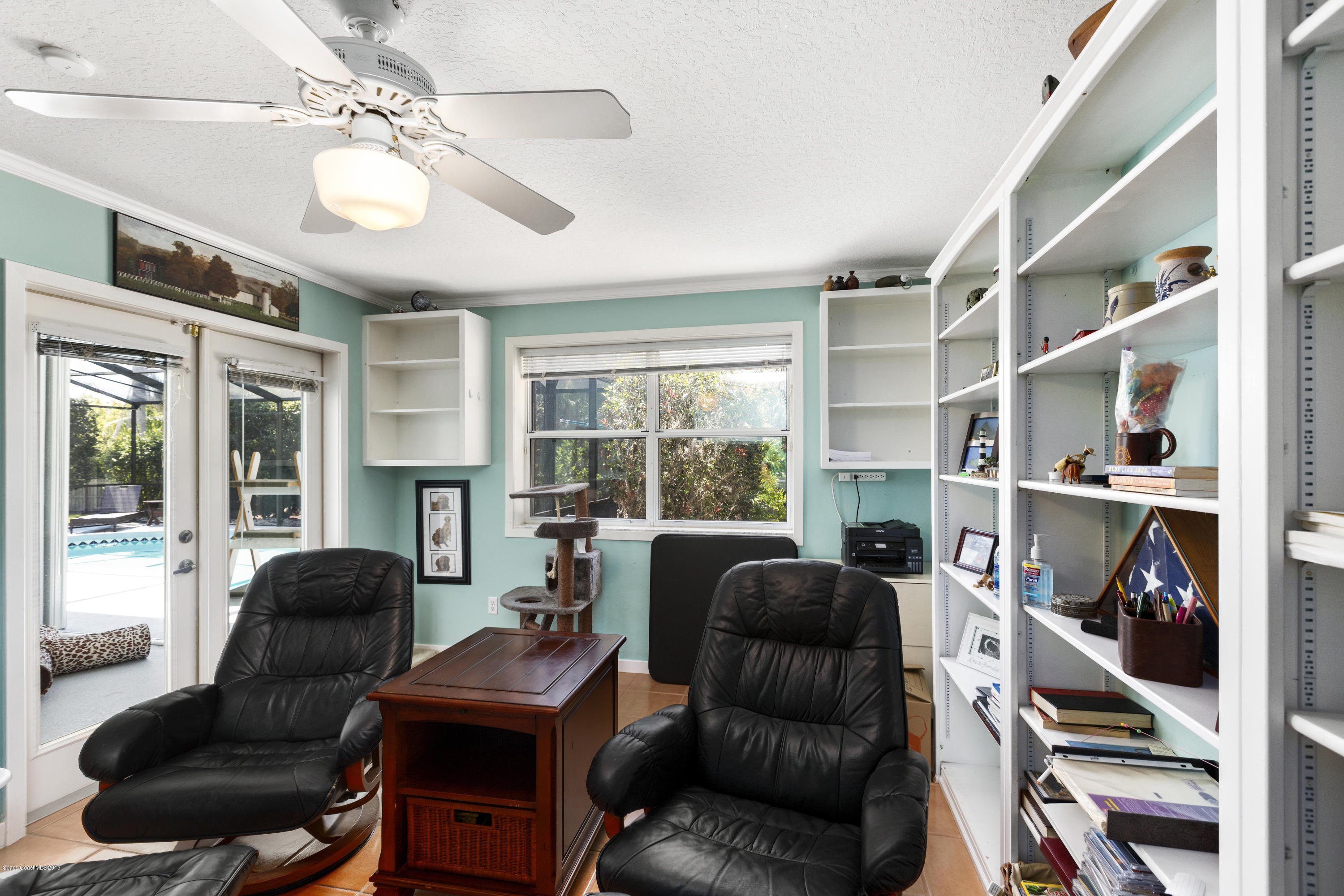 4231 Turtle Mound Road Melbourne, FL 32934 - Photo 14 of 39 a living room with furniture and a large window