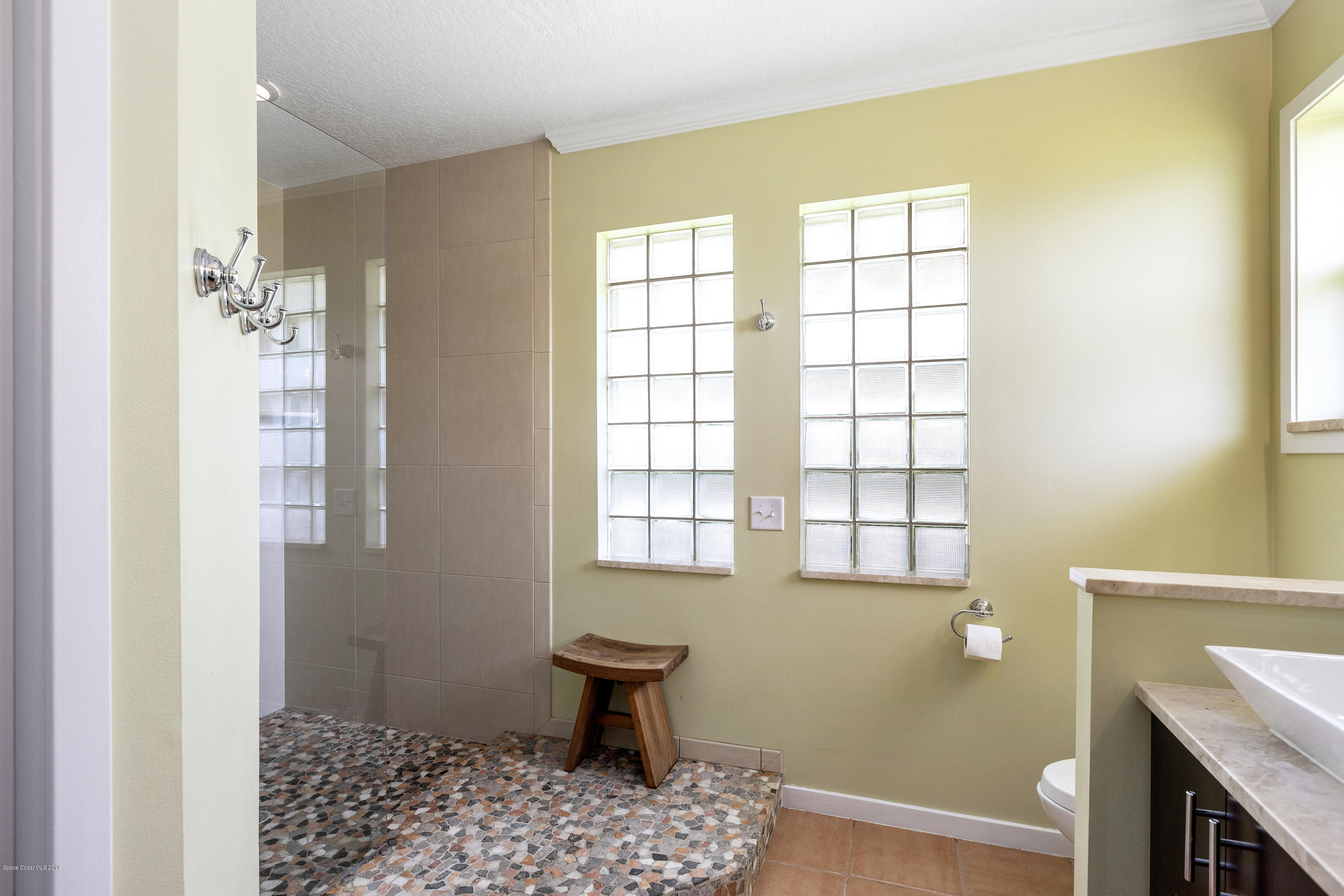 4231 Turtle Mound Road Melbourne, FL 32934 - Photo 25 of 39 a room with window and wooden floor