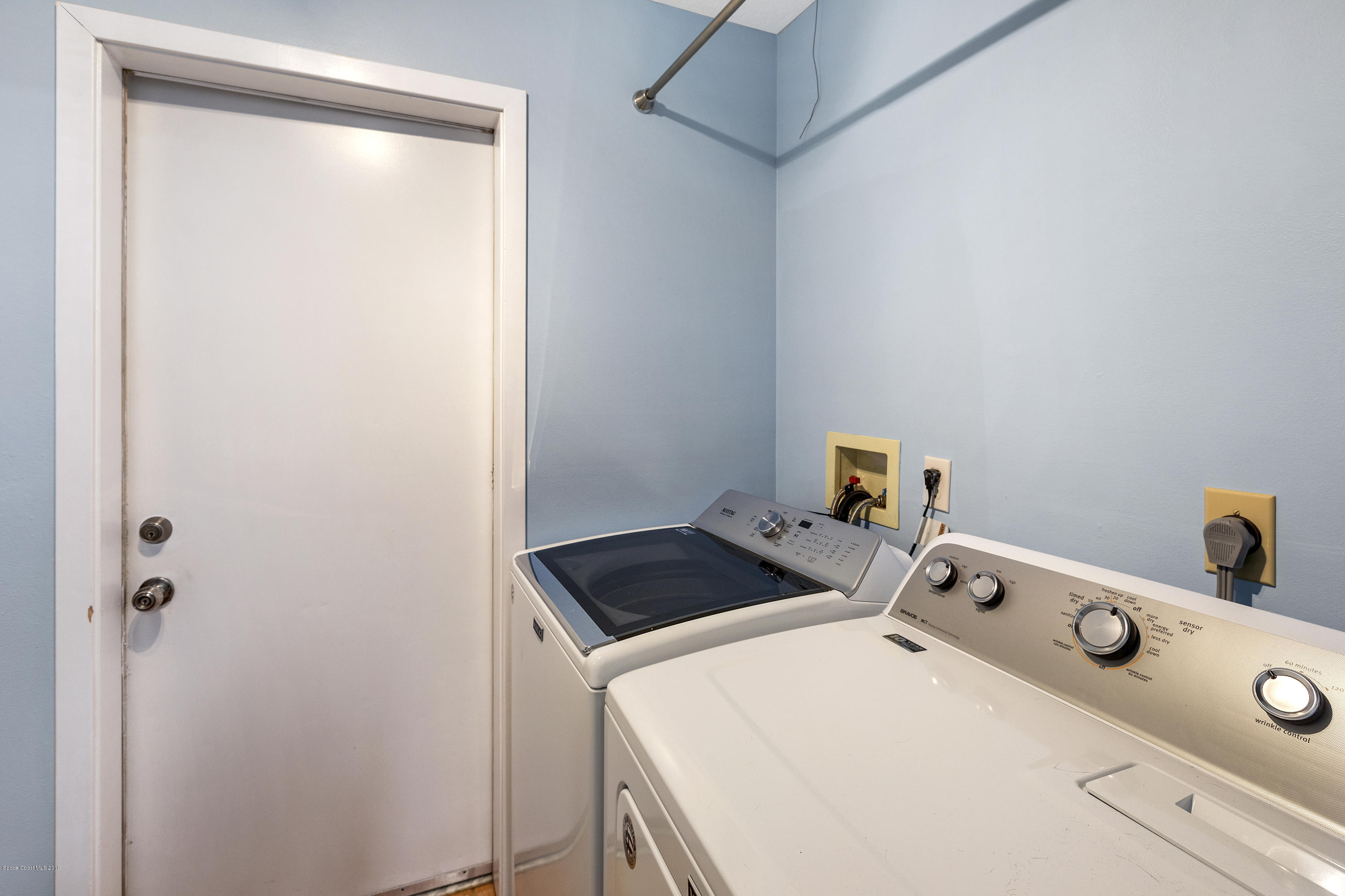 4231 Turtle Mound Road Melbourne, FL 32934 - Photo 28 of 39 a utility room with dryer and washer