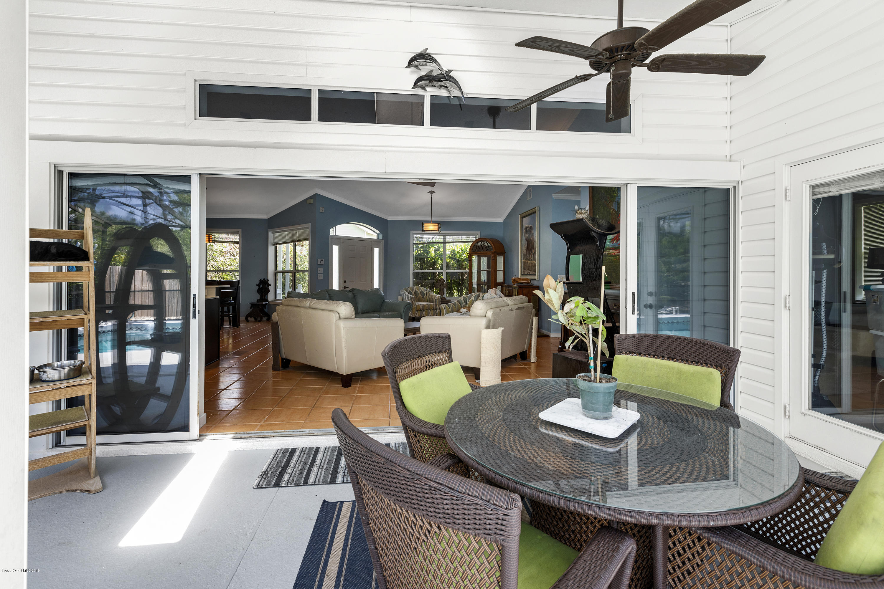 4231 Turtle Mound Road Melbourne, FL 32934 - Photo 29 of 39 a view of a dining room with furniture and a potted plant