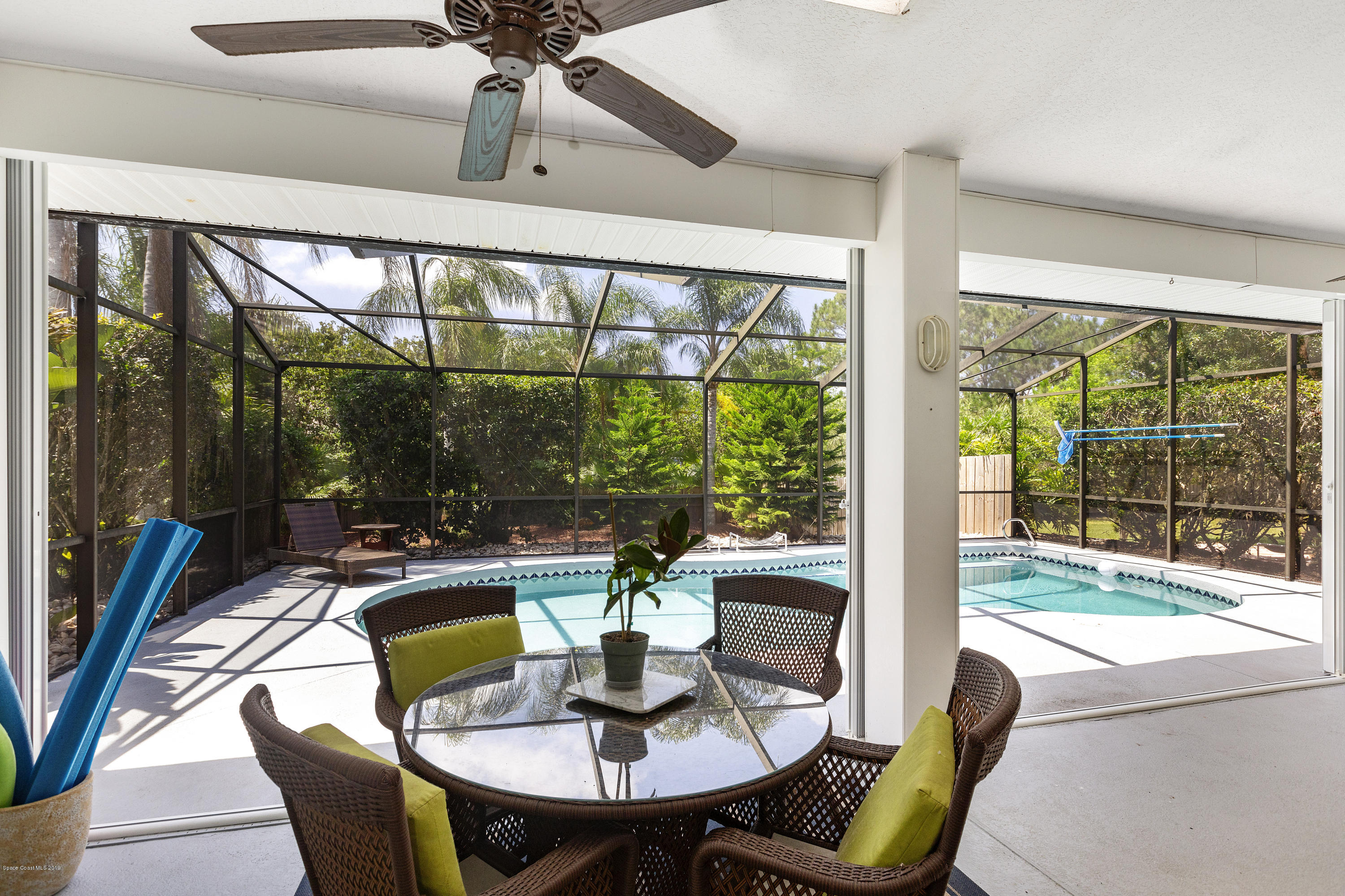 4231 Turtle Mound Road Melbourne, FL 32934 - Photo 30 of 39 a view of a dining room with furniture window and outside view
