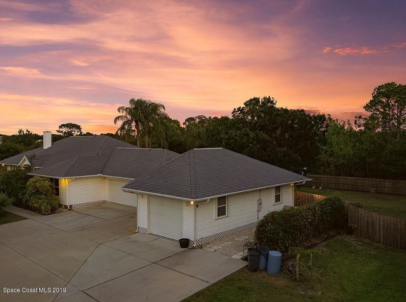 4231 Turtle Mound Road Melbourne, FL 32934 - Photo 38 of 39 a aerial view of a house next to a yard