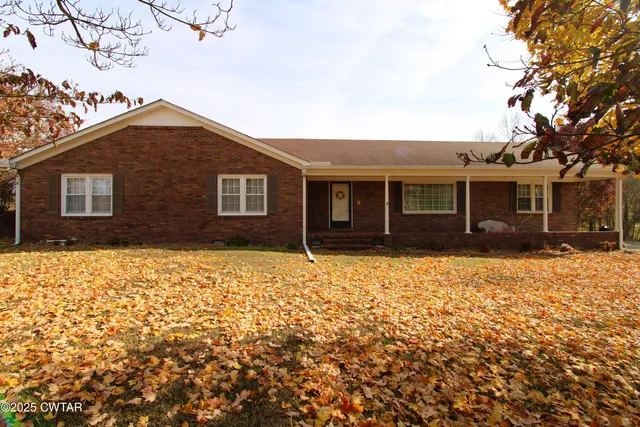 a view of a lake with a yard