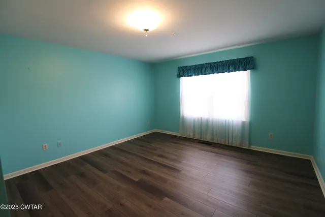 a white bath tub sitting next to a white sink
