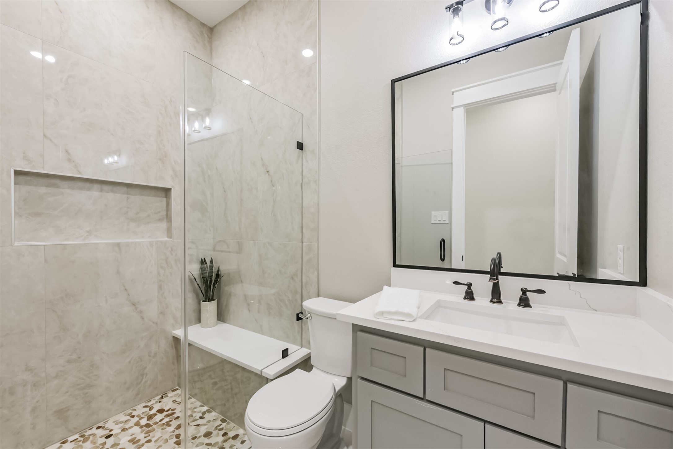 2803 Lancaster Lane Pasadena, TX 77506 - Photo 32 of 45 a bathroom with a sink a toilet and shower
