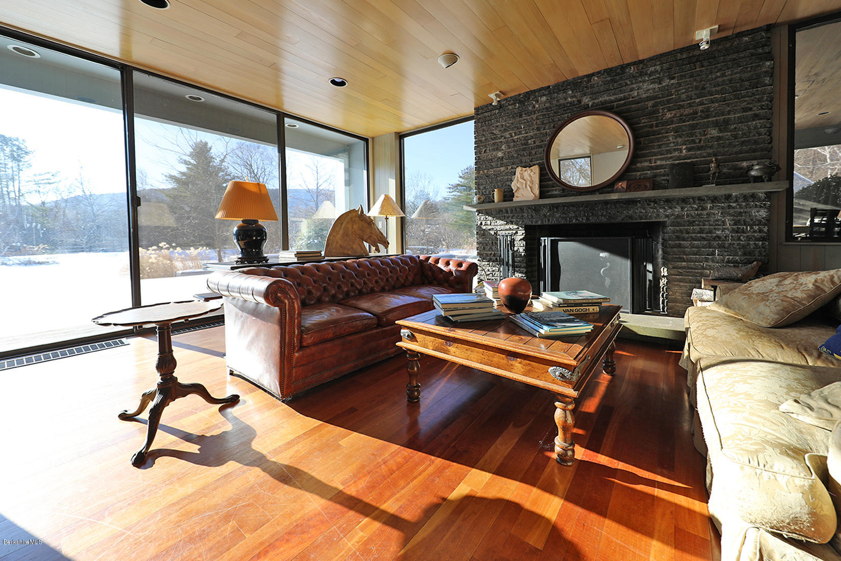 12 Red Rock Road West Stockbridge, MA 01266 - Photo 7 of 31 a living room with furniture a fireplace and a large window