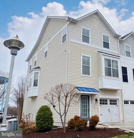 a front view of a house with parking space