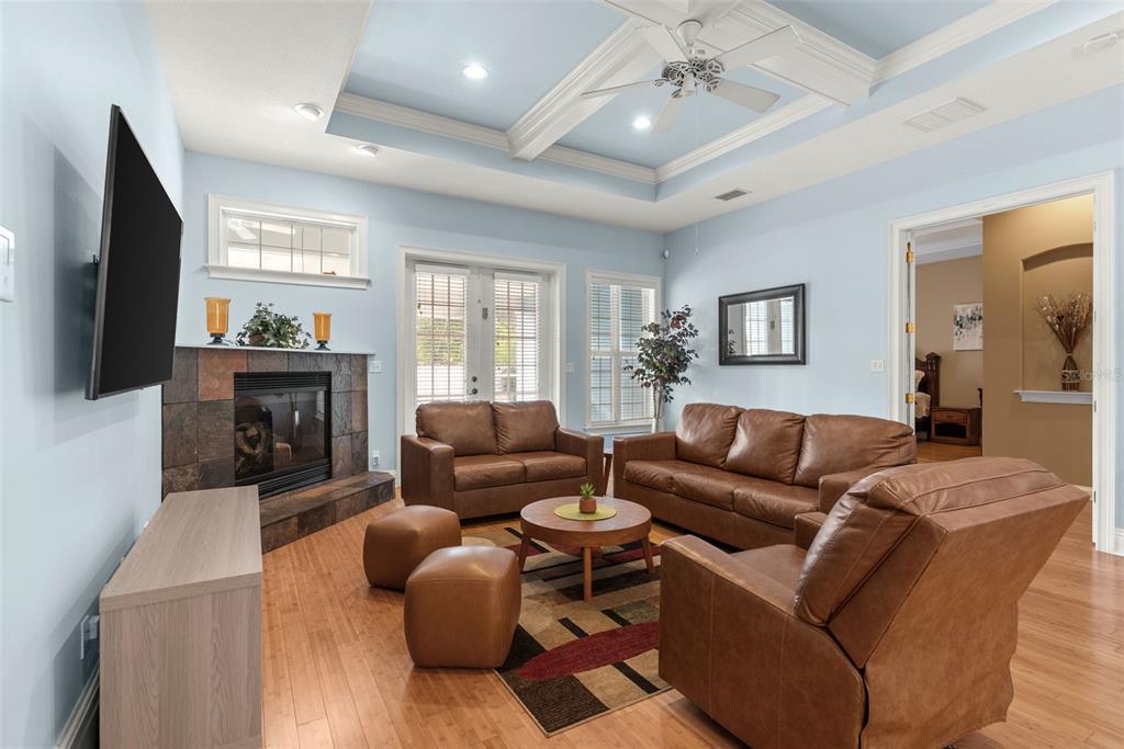 12080 143rd Street North Largo, FL 33774 - Photo 11 of 49 a living room with fireplace furniture and a flat screen tv