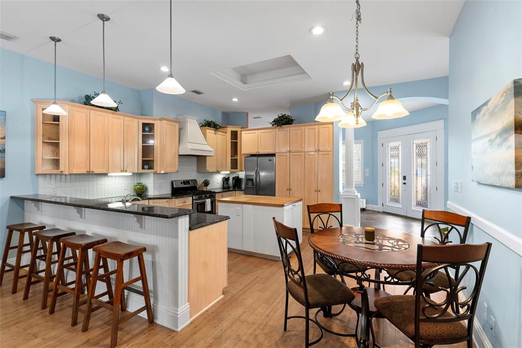 12080 143rd Street North Largo, FL 33774 - Photo 18 of 49 a large kitchen with a table and chairs