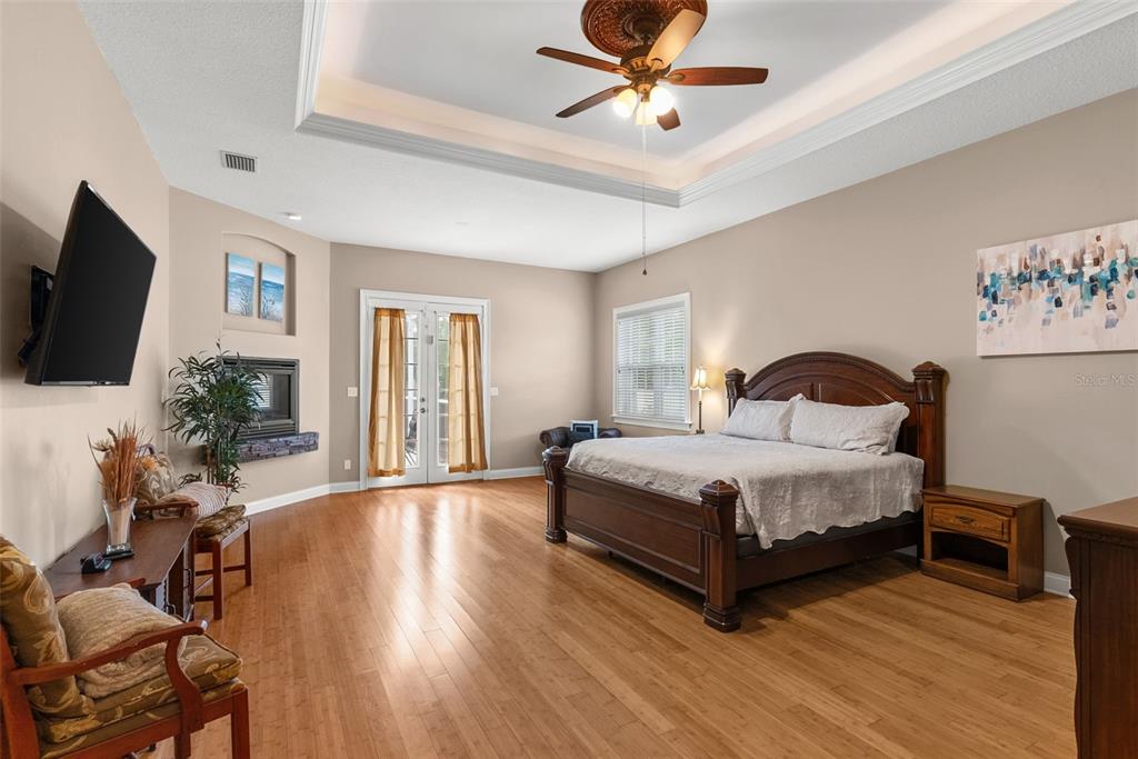 12080 143rd Street North Largo, FL 33774 - Photo 19 of 49 a bedroom with a bed window and a flat screen tv