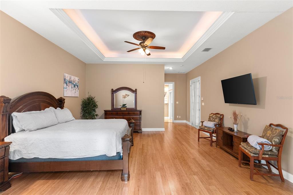 12080 143rd Street North Largo, FL 33774 - Photo 20 of 49 a bedroom with a bed and a flat screen tv